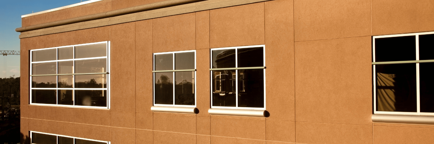 warehouse building with loading docks and parking lot.